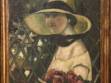 portrait of a woman in a straw hat holding a bouquet of roses