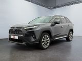 une Toyota RAV grise garée dans une grande pièce