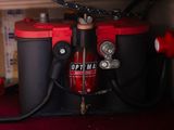 a red and black fire hydrant on a red table