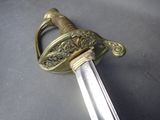 a sword that is laying on a table