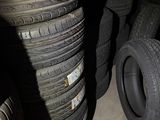 several tires stacked on top of each other in a garage