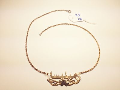 gold plated necklace with a chain and a bird charm
