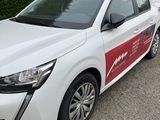 a picture of a white and red car parked in a parking lot