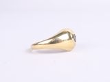 an image of a gold ring with a black stone in the middle