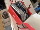 a person holding a box with tools inside of it