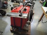 a picture of a machine that is sitting on a pallet in a garage