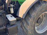 a tractor that is parked on the side of the road
