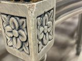 an image of a close up of a chair with a flower design on it