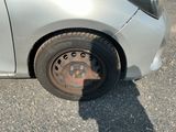 a car that has a flat tire on the street