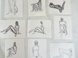 several sketches of a woman sitting on a bed with her legs crossed