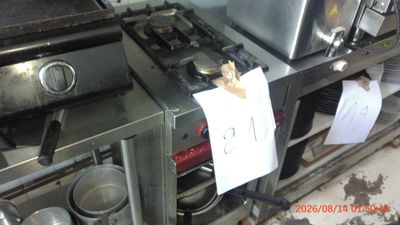 an image of a kitchen with a lot of pots and pans on the counter