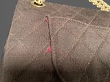 a close up of a purse with a chain on it