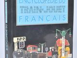une image représentant un livre dont la couverture comporte l'illustration d'un train