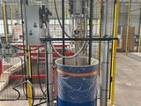 an image of a large blue barrel sitting on top of a red cart