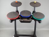 a drum set up on a stand in a room