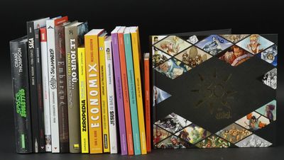a lot of books that are sitting on a table