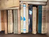 many books on a shelf in a box