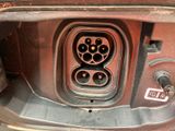 an image of a close up of a car ' s trunk with an electrical outlet