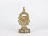 an image of a gold statue with a crown on top of it