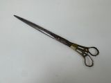 a close up of a pair of scissors on a table