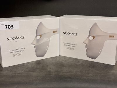 two boxes of noogance products sitting on a counter top