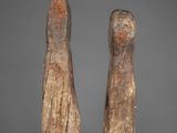 pair of carved wooden figures of a man and a woman