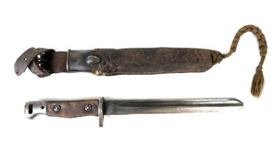 an old knife with a leather sheath on a white background