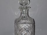 an image of a glass decanter with smoke coming out of it