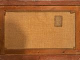 an old wooden frame with a painting of a man on it