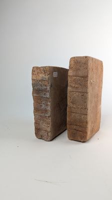 two pieces of wood stacked on top of each other