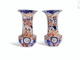 pair of chinese vases with blue and orange designs on them