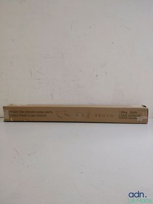 an empty box sitting on top of a table next to a wall