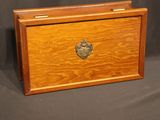 an old wooden box with a heart on the lid