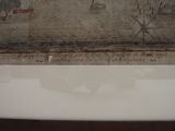 a picture of a bathtub in a bathroom that has a picture of a man on it