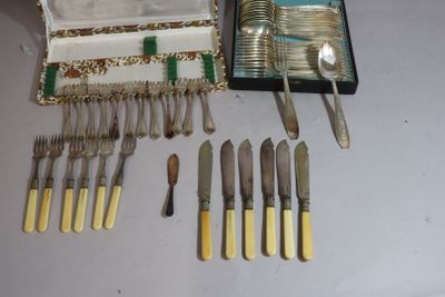 a lot of silverware in a case on a table