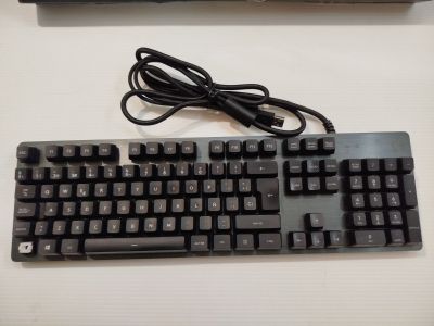 a computer keyboard and a mouse on a table