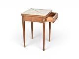 a small wooden table with a marble top on it
