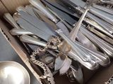 a box full of silverware and spoons in it