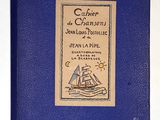 a blue book with a picture of a ship on it