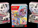 two boxes of pokemon trading cards are sitting next to each other