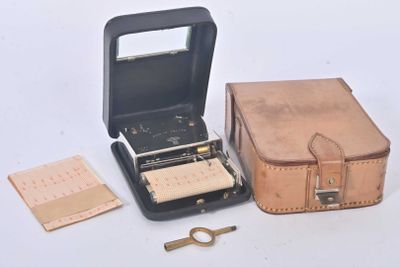 a suitcase and a pair of scissors next to it