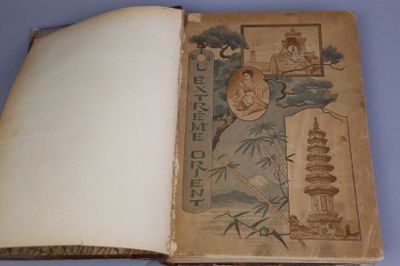 an old book that is open on a blue surface