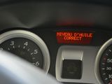 a close up of a car dashboard with a speedometer