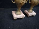 two vases that are sitting on top of each other
