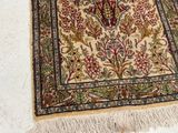 a rug with a cross on it on a white floor