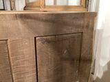 a wooden door with a glass window in the corner of the room