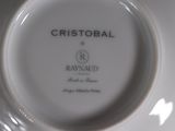 a white plate with a black and white logo on it