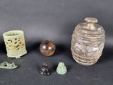 several pieces of pottery sitting on top of a table next to each other