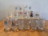 a lot of glasses sitting on a wooden table