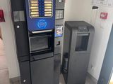 a vending machine in the corner of a room